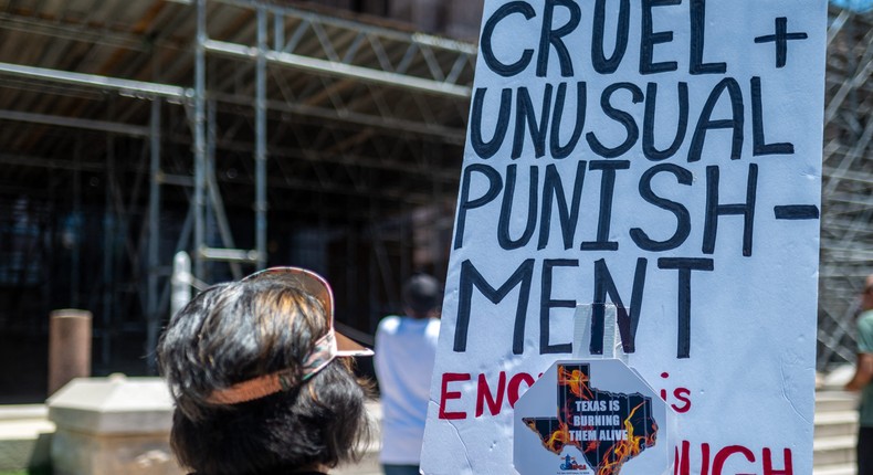 Protesters gather outside the Texas State Capitol building in Austin, Texas, on July 18, 2023. Activists visited the capitol to discuss the need for air conditioning in Texas state prisons.Photo by SERGIO FLORES/AFP via Getty Images