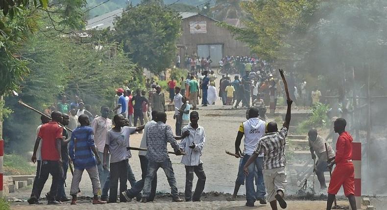 A protester opposed to the Burundi President Pierre Nkurunziza's third term is snatched by members of the 'Imbonerakure', the youth wing of the ruling party, in Bujumbura on May 25, 2015 