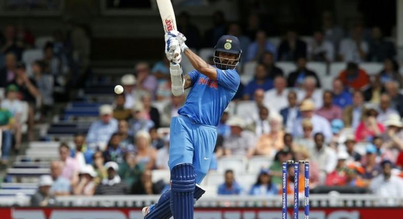 India's Shikhar Dhawan plays a shot on June 11, 2017