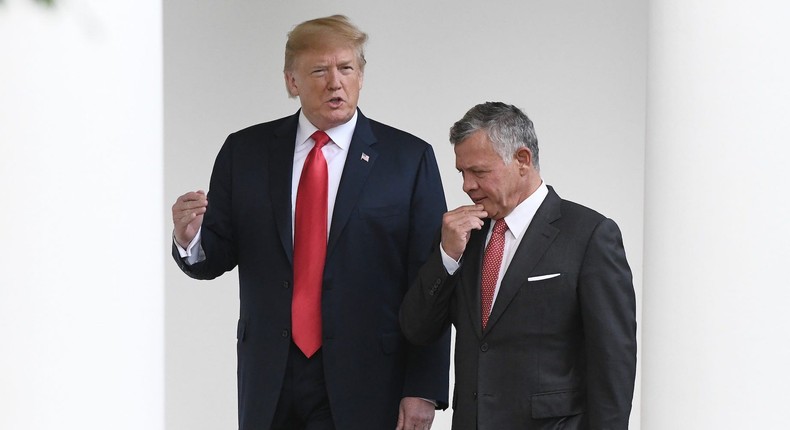 President Donald Trump and King Abdullah II walk the colonnade of the White House on June 25, 2018 in Washington, DC.