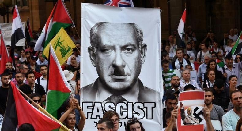 Pro-Palestinian activists demonstrate against a visit by Israel PM Benjamin Netanyahu, during a protest rally in Sydney, on February 23, 2017