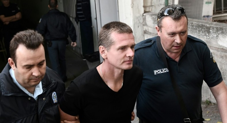 Russian Alexander Vinnik, centre, has been held in custody since his arrest last year on suspicion of money laundering