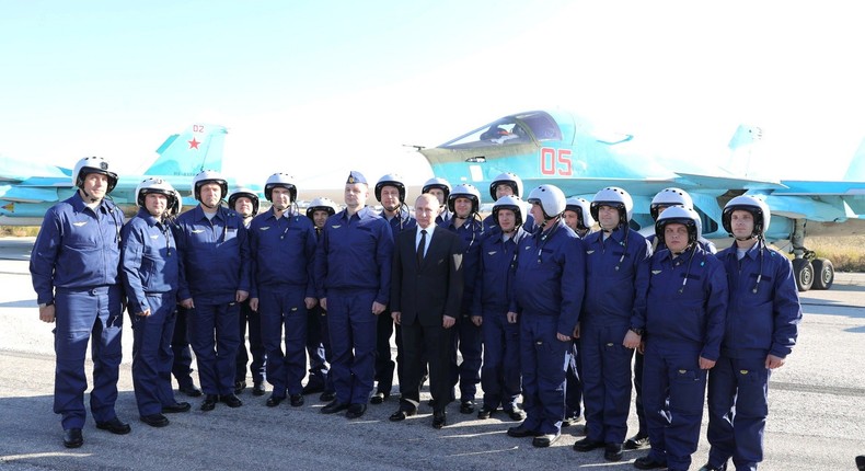 Russian forces at Khmeimim air base, pictured here in a 2017 photo with Russian leader Vladimir Putin, are likely still maintaining a presence in Syria.Anadolu/Getty Images