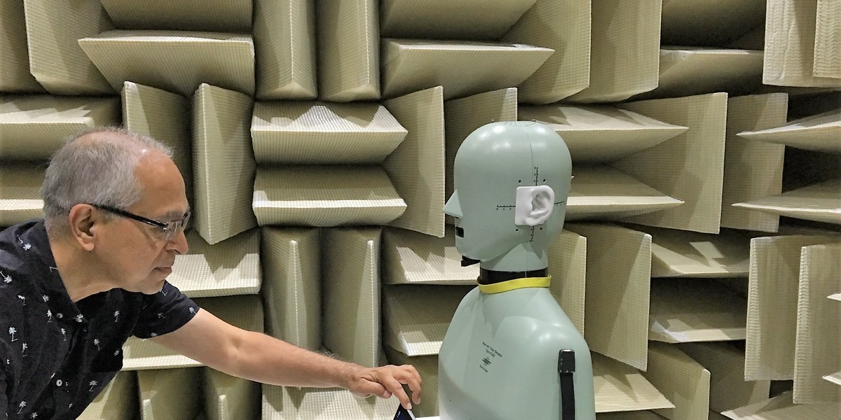 Microsoft principal engineer Gopal Gopal in the quietest room in the world. The dummy is for headphone and microphone testing.