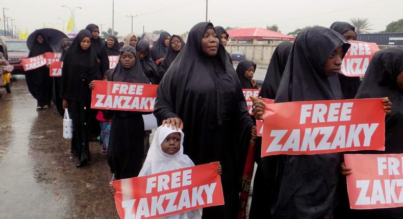 Picture from the Northern Nigerian city of Kano shows protesters from the pro-Iranian Islamic Movement in Nigeria (IMN) marching in the rain through the streets to press for the release of their leader Ibrahim Zakzaky and his wife on November 5, 2016