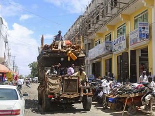 A truck drives through Bakara market in Mogadishu October 5, 2013. Street lamps now brighten some of Mogadishu's battle-scarred roads and couples hold hands at the seaside next to bombed-out beachfront buildings, a scene that would have been unthinkable w