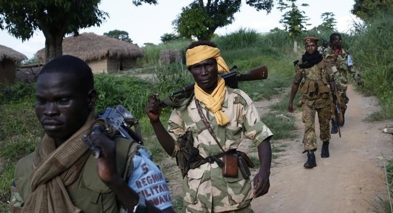 Seleka fighters patrol as they search for Anti-Balaka Christian militia members in the town of Lioto June 6, 2014. REUTERS/Goran Tomasevic