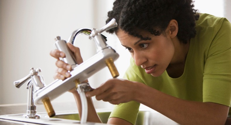 woman doing home repairs renovation