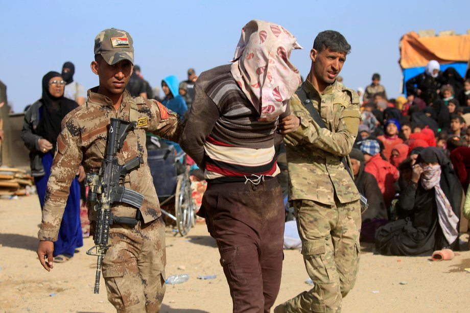 Iraqi special-operations forces arrest a person suspected of belonging to ISIS in western Mosul, Iraq, February 26, 2017.