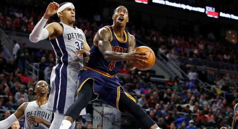 Iman Shumpert of the Cleveland Cavaliers looks to get a shot off around Tobias Harris of the Detroit Pistons during the second half, at the Palace of Auburn Hills in Michigan, on December 26, 2016