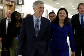 Supreme Court nominee Judge Neil Gorsuch (C) arrives for a meeting with Senator Bob Corker