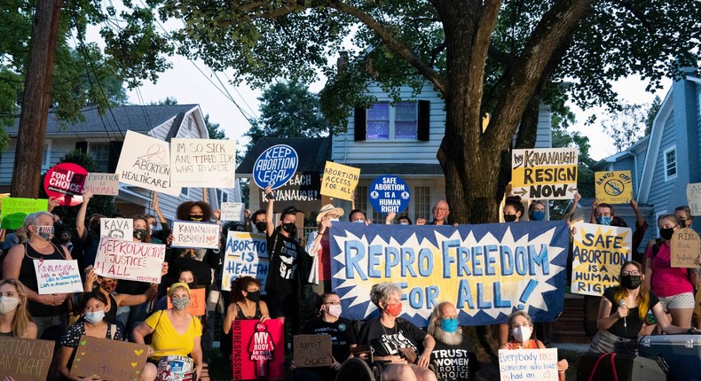 Protesters gather outside the home of Supreme Court Justice Brett Kavanaugh, Monday, Sept. 13, 2021, in Chevy Chase, Md.
