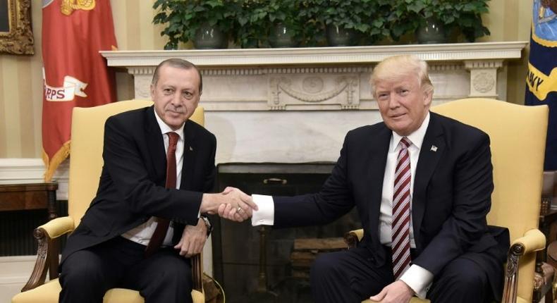 US President Donald Trump shakes hands with Turkish President Recep Tayyip Erdogan in the Oval Office