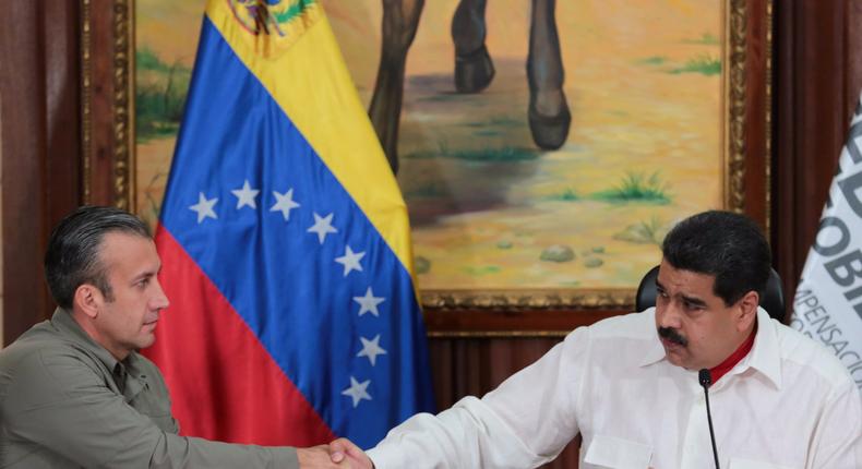 Venezuela's President Nicolas Maduro, right, and Venezuela's Vice President Tareck El Aissami, shake hands during a meeting with governors in Caracas, Venezuela, February 14, 2017.