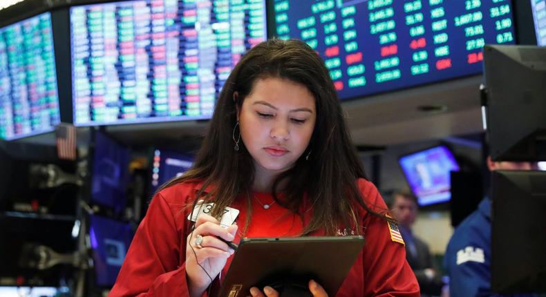 Traders work on the floor of the New York Stock Exchange shortly after the opening bell in New York, U.S., March 17, 2020.