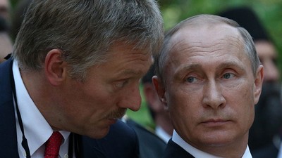 Russian President Vladimir Putin (right) and Kremlin spokesperson Dmitry Peskov (left).Mikhail Svetlov/Getty Images