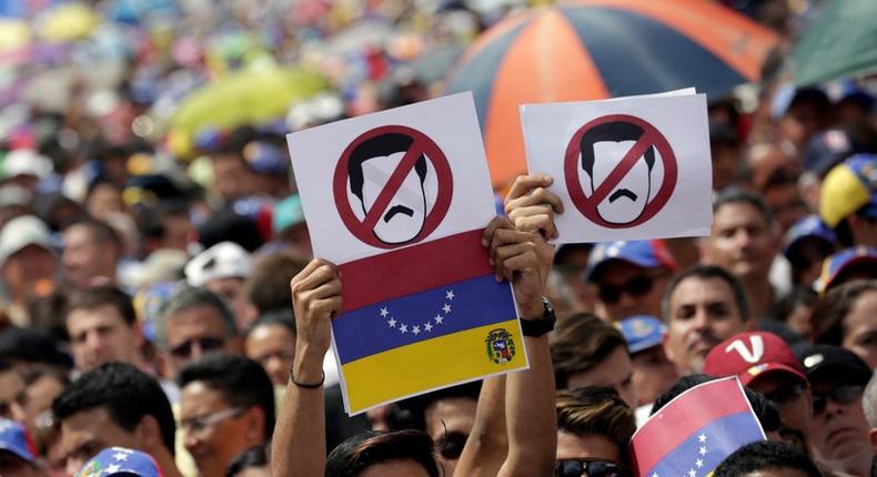 Opposition supporters rally against President Nicolas Maduro's government in Caracas, Venezuela, October 26, 2016.