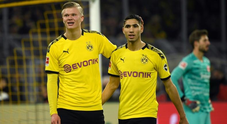 Dortmund forwards Erling Braut Haaland (L) and Achraf Hakimi (R) celebrate Friday's 4-0 win over Eintracht Frankfurt.