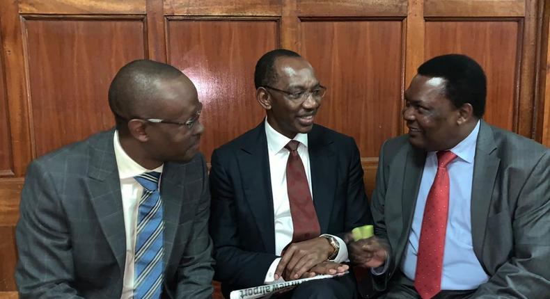 Businessman Humphrey Kariuki with his lawyers during a past court appearance