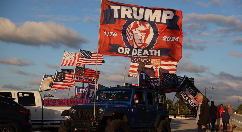 Robert Fix shows his support for Donald Trump by flying a Trump or death flag near the embattled former president's Mar-a-Lago home on March 20, 2023 in Palm Beach, Florida.Joe Raedle/Getty Images