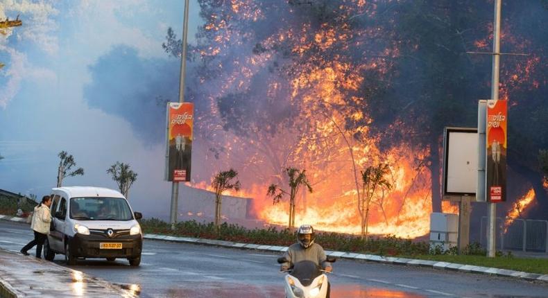 Israeli authorities evacuated 60,000 people from Haifa because of a spate of wildfires