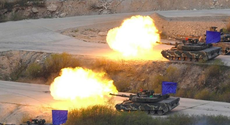 South Korean K1A2 tanks fire live rounds during a joint live firing drill between South Korea and the US at the Seungjin Fire Training Field in Pocheon on April 26, 2017