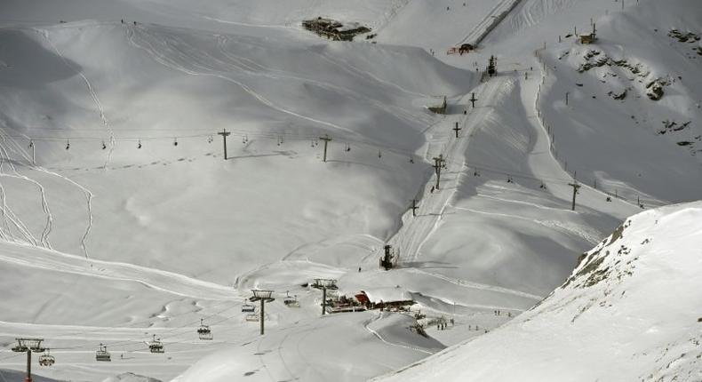 A late-season avalanche killed two skiers and their guide in the French Alps near the Italian border, local officials said