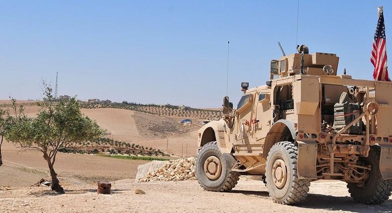 U.S. personnel provide security during an independent patrol outside Manbij, Syria, Aug. 11, 2018. These independent, coordinated patrols are conducted with Turkish military forces who stay on the opposite side of the demarcation line.