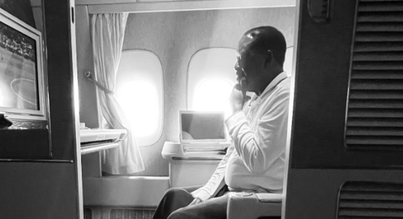 Azimio presidential flagbearer Raila Odinga aboard a plane during trip to Washington DC on April 23, 2022