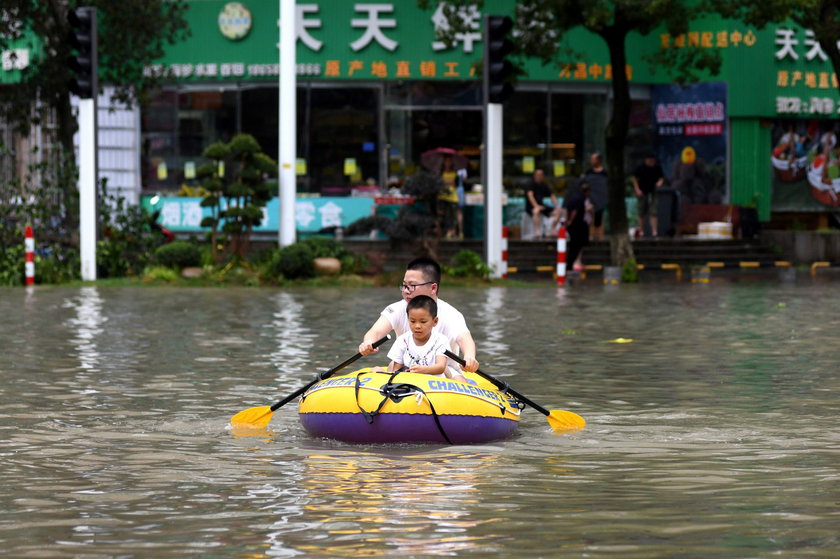 Cars are partially submerged in floodwaters after Typhoon Lekima hit Dajing town in Wenzhou, Zhejian