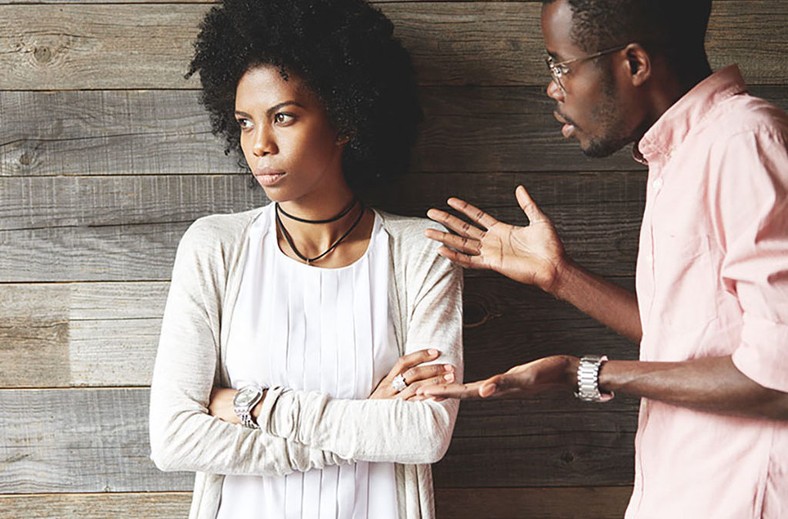 Man angrily speaking with woman [Credit: Getty]