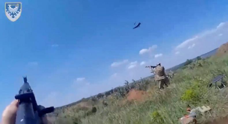 Ukrainian soldiers shoot at what Ukraine said Russian Lancet drones in a still image from a video released in May 2023.Ukraine Defense Ministry/Handout via REUTERS