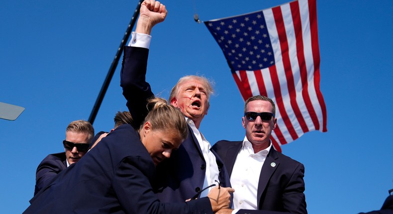 Trump appeared to be bleeding from the ear when he was escorted off stage following loud pops that rang out during a rally in Pennsylvania.Evan Vucci