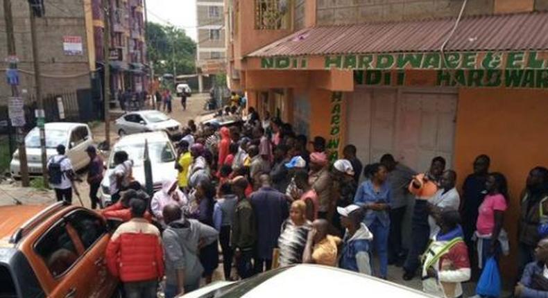 A crowd outside the building where a woman was found dead in an apartment reported to be an airbnb in Roysambu