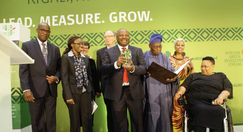 IITA Director-General, Dr Sanginga, pictured as he receives the Africa Food Prize, along with Olusegun Obasanjo, chairperson of Africa Food Prize Committee and its members in Kigali on Friday. (africafoodprize)