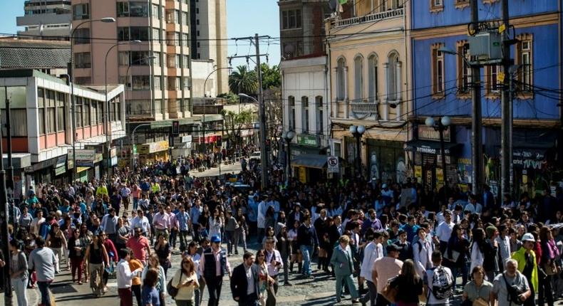 People walk to higher ground during an earthquake and tsunami drill in Valparaiso, a day before a 6.4-magnitude earthquake of great intensity struck central Chile on November 4, 2016