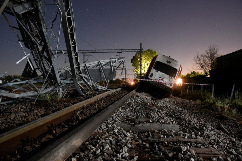 A derailed train carriage is seen toppled in the town of Adendro in northern Greece