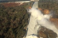 A damaged spillway with eroded hillside is seen in an aerial photo taken over the Oroville Dam in Or