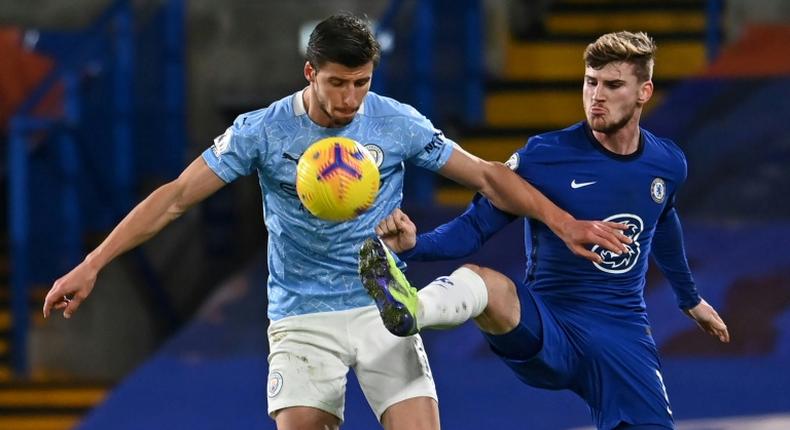 Ruben Dias (left)has made a massive difference to Manchester City's defensive record this season