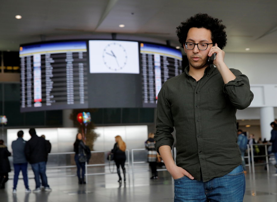 Mark Doss, Supervising Attorney for the International Refugee Assistance Project at the Urban Justice Center speaks on his cell phone at John F. Kennedy International Airport in Queens, New York, U.S., January 28, 2017.