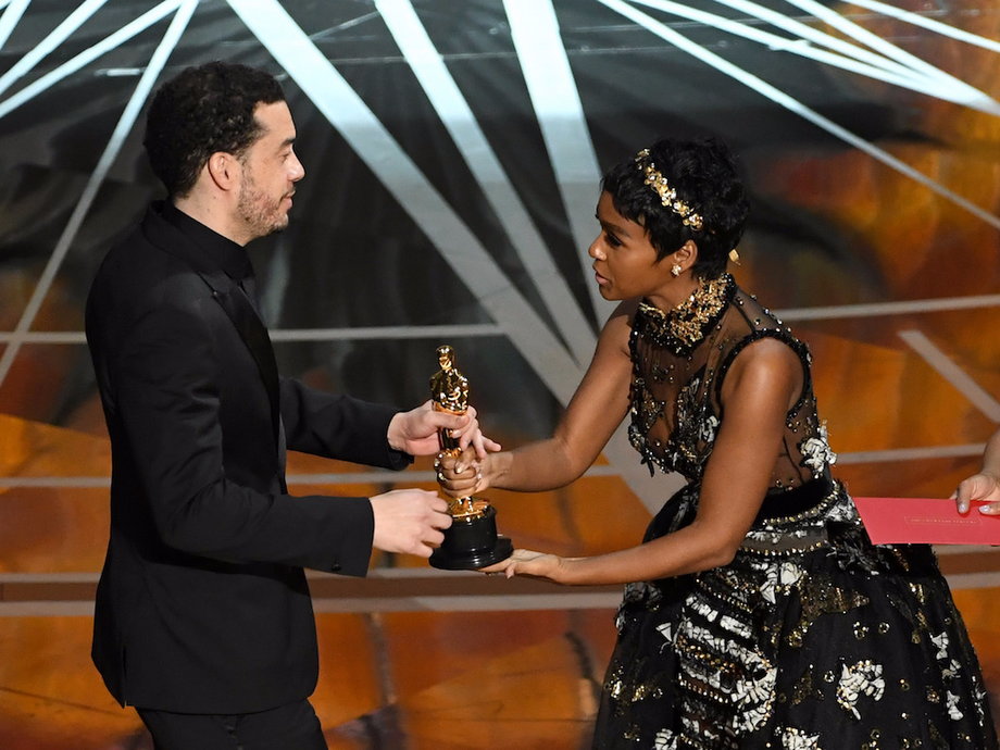 Director Ezra Edelman accepts best documentary feature for "O.J.: Made in America" from singer and presenter Janelle Monae.