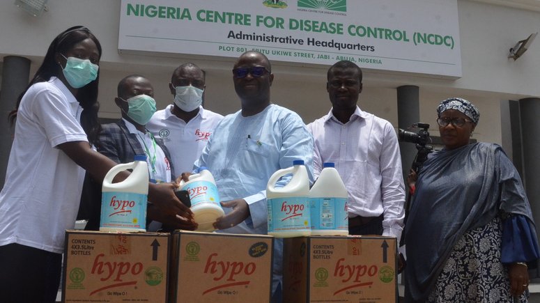 L-R: Sales Manager, Multipro Consumer Product Limited, Central Region Abuja, Miss. Acquaye Matilda; Marketing Manager MCPL, Mr. Muhammed Abubakar; Sales Manager MCPL, Mr. Enu Jubril , Incident Manager Covid 19 NCDC, Dr. John Oladejo; Assistant Director Logistics NCDC, Mr. Gbenga Joseph; and Head of Store NCDC, Mrs. Ali Hawal during HYPO donation of 200 cartons of Bleach to NCDC, Abuja