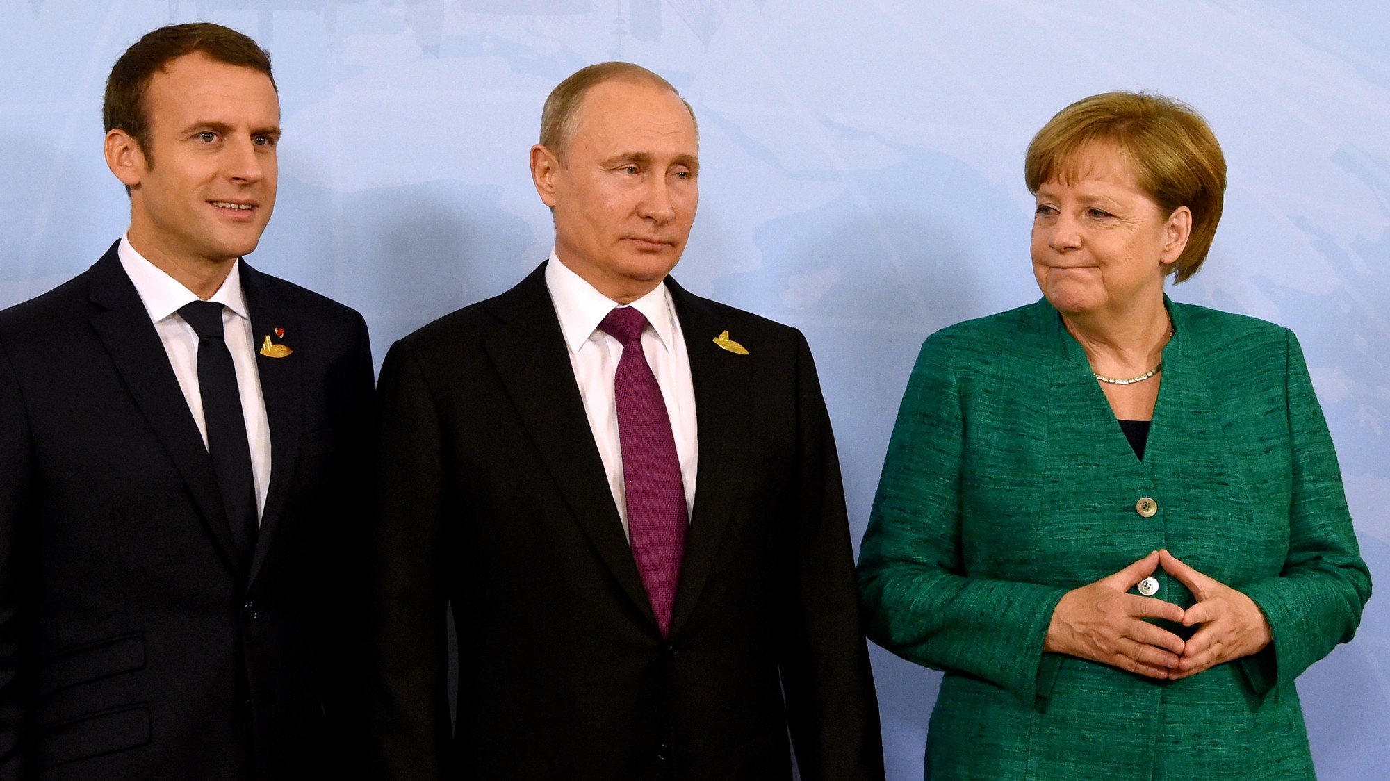 Macron, Putin a Merkelová počas stretnutia na samite v Hamburgu