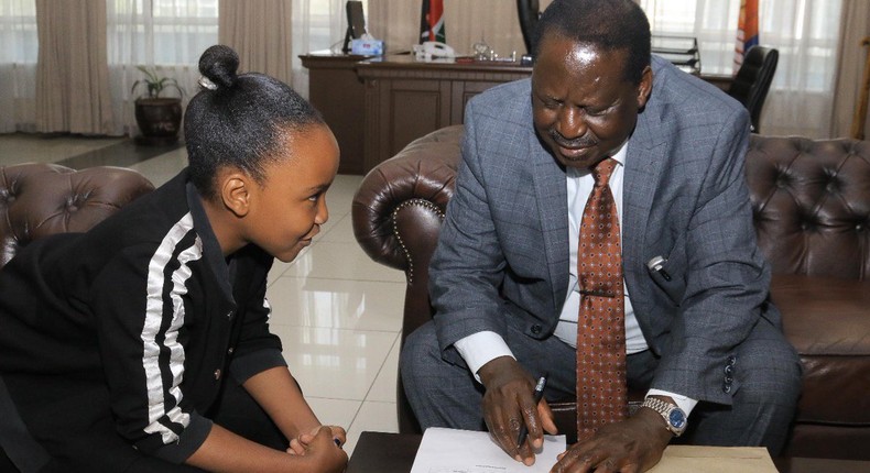 AU envoy Raila Odinga with Wendy Waeni at his office