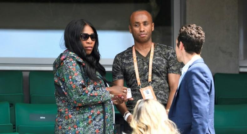 Serena Williams (L) leaves after attending her sister Venus Williams' tennis match against Japan's Kurumi Nara at the French Open