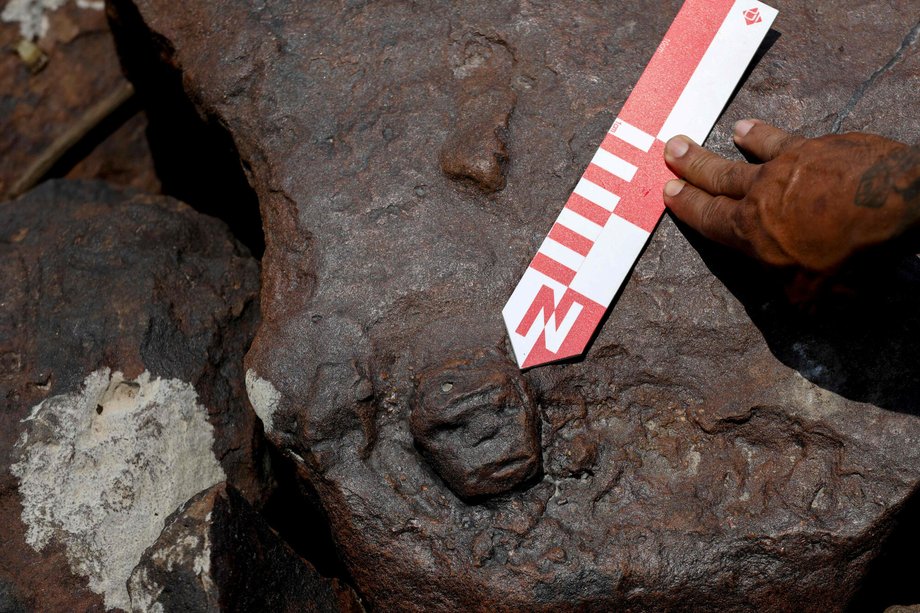 A face carved into a rock found at the Lajes archaeological site in a pH๏τo from October 21, 2023.