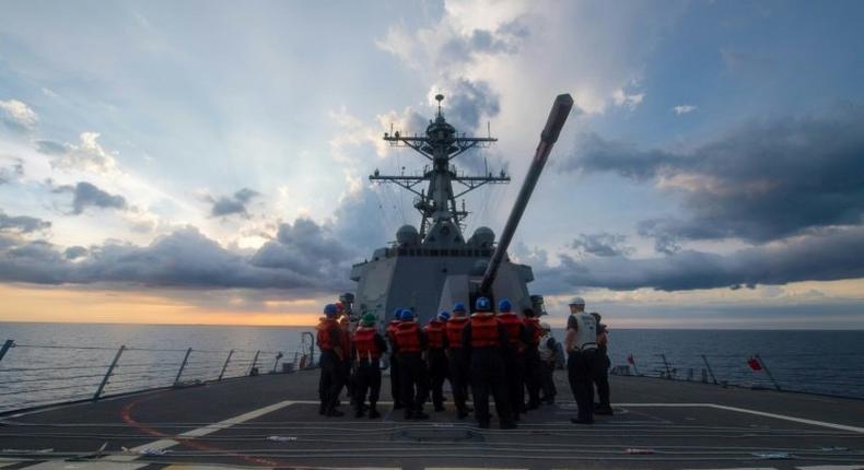 The USS Dewey has sailed in disputed South China Sea waters near a reef claimed by Beijing