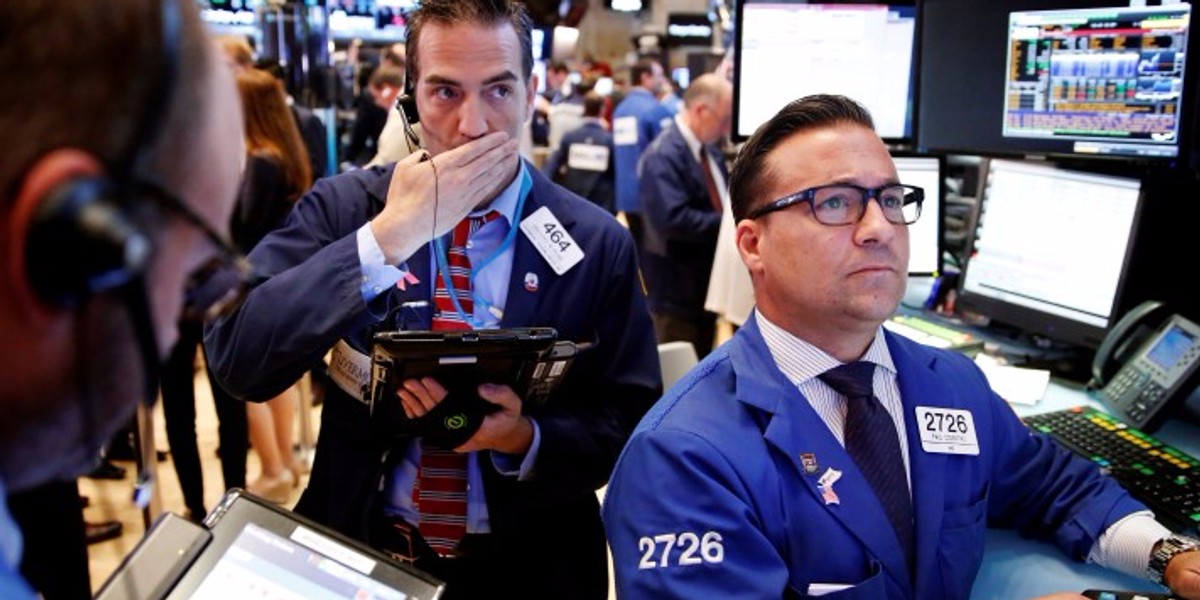 Traders work on the floor of the New York Stock Exchange (NYSE) shortly after the opening bell in New York