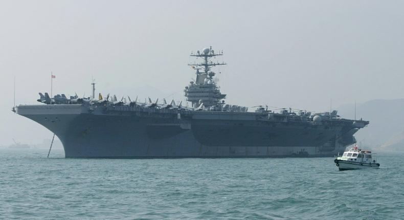 The United States says it is deploying the USS Abraham Lincoln, seen here in December 2004, in response to 'escalatory indications' from Iran