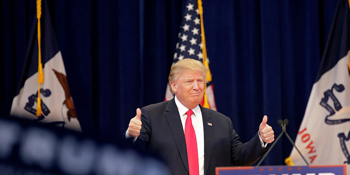 Republican presidential candidate Donald Trump gives a thumbs-up as he is introduced during a campaign event.